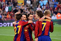 F.C. Barcelona players celebrating a goal. Left to right: Bojan Krkic, Leo Messi, Xavi Hernandez, Carles Puyol and Eidur Gudjohnsen