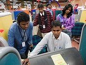 Call center workers on the job in call center for multinational corporations in Bangalore, Karnataka, India