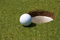 golf ball short of hole
