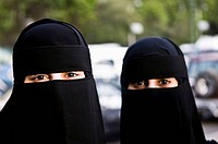 Arab women wearing traditional black Burka.