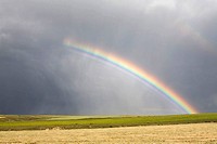 Steppe and cereal fields  Rainbow in a summer storm  Agricultural landscape in Monterrubio De La Armuna  Salamanca  Castille and Leon  Spain