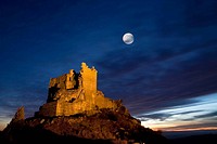 Night view of Castle Trevejo with the moon  Trevejo  Villamiel  Sierra de Gata  Caceres province  Extremadura  Spain