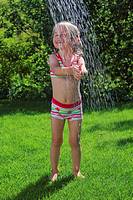 girl having shower outdoors, Switzerland