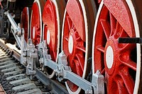 Red iron wheels of the retro steam locomotive