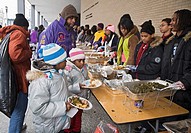 Washington, DC - Volunteers serve food to the hungry at an outdoor soup kitchen  The volunteer project was one of many Martin Luther King Day communit...