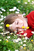 Little girl sleeping in meadow