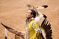 American Lakota Indian warrior in traditional ceremonial oufit at pow-wow