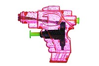 Pink transparent plastic water pistol isolated on a white background