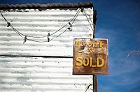 Route 66, Arizona - An antique sign on an abandon building along the road