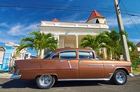 classic car parked in a typical street in Cuba