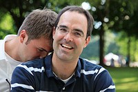 Affectionate outdoor portrait of two gay men