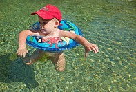 boy with a rubber ring on a river in Ludiente, Castellón