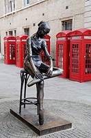 Statue of Ballerina and red telephone boxes near the Royal Opera House Covent Garden, London, England