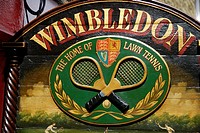 Old hand painted wooden advertising sign promoting the Wimbledon lawn tennis club, Portobello Road, London, England