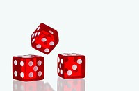 Three red dice being rolled on a white background, these are the type of dice used in casinos around the world