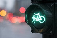 Close-up of traffic light for bicyclists, showing green light at an intersection with blurred background, Hamburg, Germany, Europe