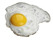 Fried egg, isolated over white background