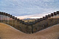 United States border fence, US/Mexico border, east of Nogales, Arizona, USA, looking south from US side of border