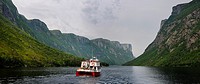 Panorama of boat tour on Western Brook Pond with steep cliff fjords at Gros Morne National Park Newfoundland