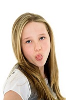 Caucasian preteen girl displaying some attitude by sticking out her tongue