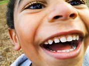 young multiracial boy, laughing joyfully  close up, Horizontal