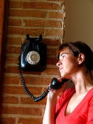 Woman using telephone