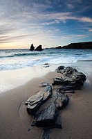 Rocks on the beach at Sunset, Porthcothan Bay Cornwall England