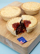Australian meat pies on a chopping board