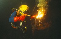 Commercial diver welding underwater
