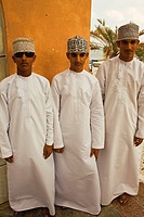 Three Omani boys wearing in the traditional way