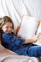 Little girl holding a book
