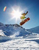 Snowboarder jumping right in