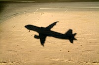 Shadow of airplane flying into land at Hurghada Airport, Hurghada, Red Sea, Egypt.
