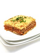 Lasagne plated up and isolated against a white background