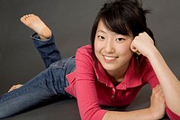 Asian Teenage girl posing on gray background with some attitude