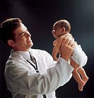 doctor examing infant