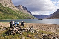 group of tourists at a historic Inuit foodcache at North Arm of Saglek Fjord, Torngat Mountains National Park, Newfoundland and Labrador, Canada