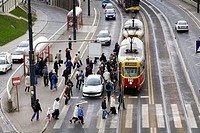 Cars, trams and people on Solidarity Avenue Aleja Solidarnosci, one of the main thoroughfares in Warsaw Poland