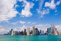 Skyscrapers of the downtown Miami skyline with Biscayne Bay and clouds in blue sky  Miami, Florida