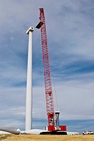 Manitowoc 16000 crawler crane lifting nacelle lid during maintenance work on wind turbine
