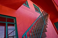 Stairway at brightly colored apartment building, Truth or Consequences, New Mexico, USA