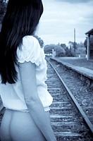 Female model waiting for train to arrive