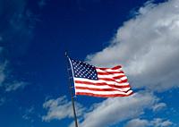 The Stars and Stripes national flag of the United States of America against a blue sky
