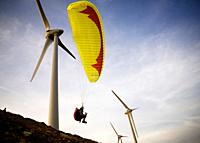 A paraglider is taking off in between the wind turbines, what would be totally insane if these would be in service: It was while the installation of t...