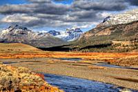 Soda Butte Creek flows before the Absaroka Mountain Range during the autumn at Yellowstone National Park, Wyoming
