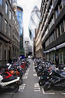 Swiss Re Tower and parked motorbikes London
