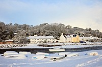 Red Wharf Bay Traeth Coch, Isle of Anglesey, North Wales, UK, Europe  Snow scene with upturned boats on the coast in winter