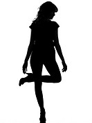 full length silhouette in shadow of a young woman standing on one leg thinking in studio on white background isolated