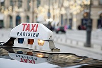 Parisian Taxi with Christmas Decoration in Background