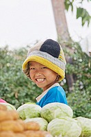 Portrait of a smiling boy in a market in Pai, Nord Thailand
